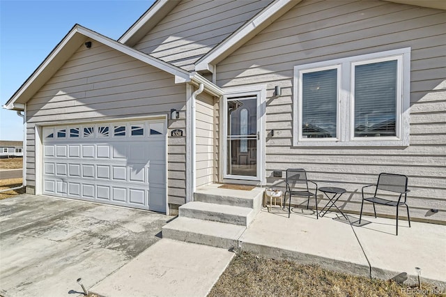 view of front of property featuring a garage and concrete driveway