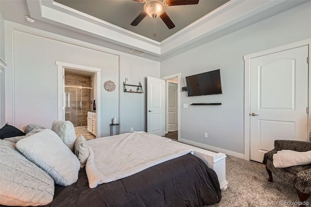 bedroom featuring carpet flooring, a raised ceiling, visible vents, and baseboards