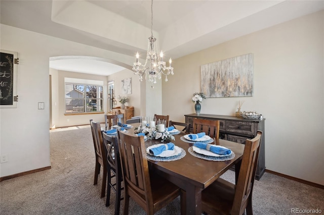 9684 W Long Dr, Littleton, CO 80123 - dining area with arched walkways, carpet, and baseboards