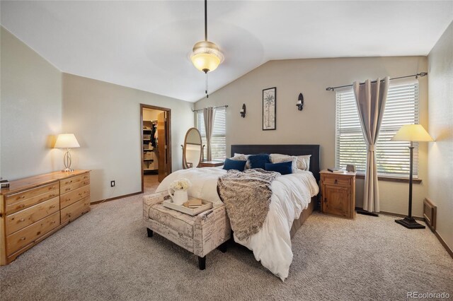 9684 W Long Dr, Littleton, CO 80123 - bedroom with light carpet, vaulted ceiling, baseboards, a spacious closet, and a ceiling fan