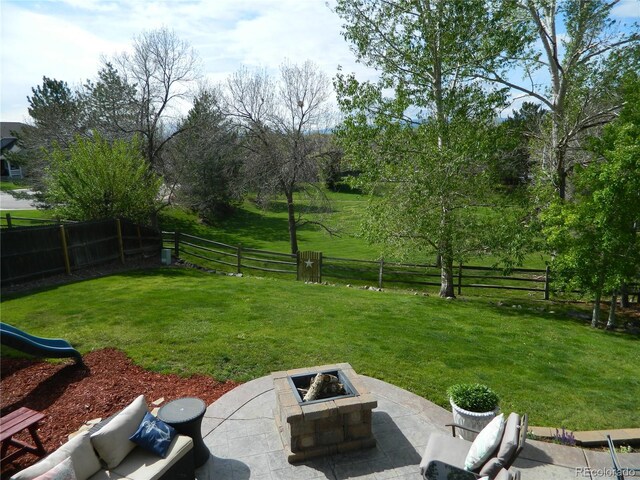 9684 W Long Dr, Littleton, CO 80123 - view of yard with a patio area and an outdoor fire pit
