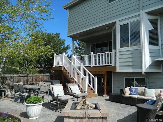 9684 W Long Dr, Littleton, CO 80123 - view of patio featuring an outdoor living space with a fire pit, stairway, and outdoor dining space