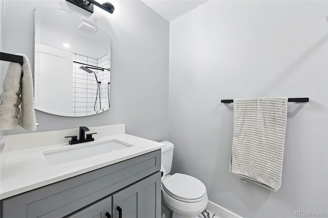 11041 Newland St, Westminster, CO 80020 - full bathroom featuring toilet, vanity, and a tile shower