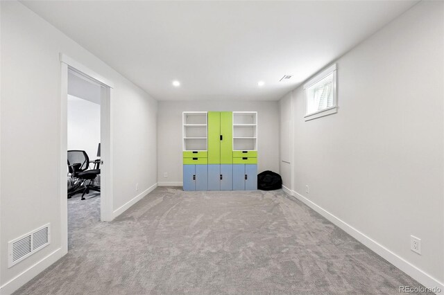 11041 Newland St, Westminster, CO 80020 - below grade area with built in shelves, baseboards, carpet flooring, and recessed lighting