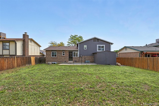 11041 Newland St, Westminster, CO 80020 - back of property with a patio area and brick siding