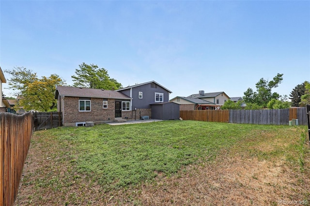 11041 Newland St, Westminster, CO 80020 - rear view of house featuring a patio area and brick siding