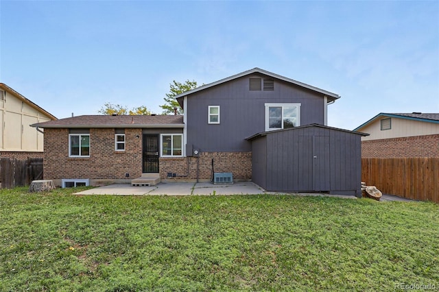 11041 Newland St, Westminster, CO 80020 - back of house with a patio area, brick siding, and central AC unit