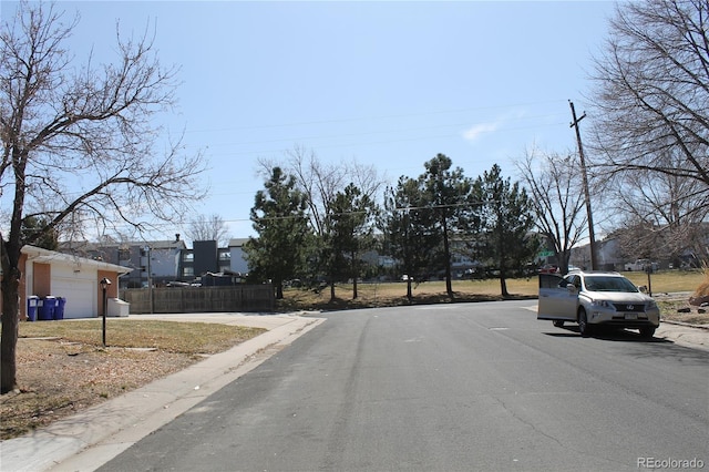 view of street with curbs