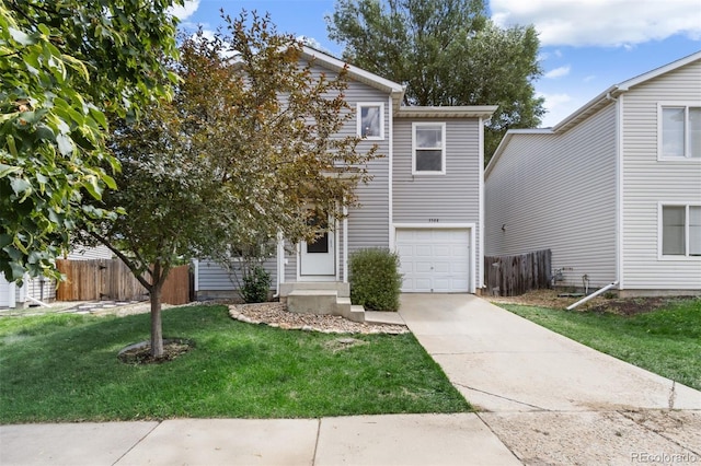 view of front of home featuring a garage and a front lawn