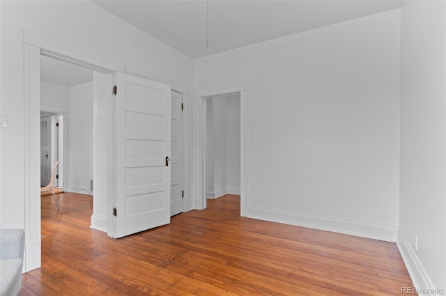 1038 E 4th Ave, Denver, CO 80218 - empty room featuring wood finished floors and baseboards