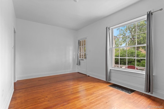 1038 E 4th Ave, Denver, CO 80218 - empty room with light wood-style flooring and baseboards