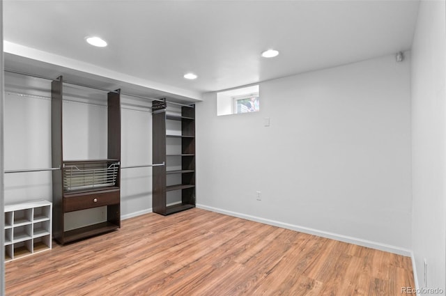 1038 E 4th Ave, Denver, CO 80218 - unfurnished bedroom with wood finished floors, recessed lighting, and baseboards