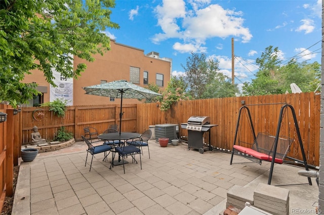 1038 E 4th Ave, Denver, CO 80218 - fenced backyard with area for grilling, a patio, outdoor dining space, and central air condition unit