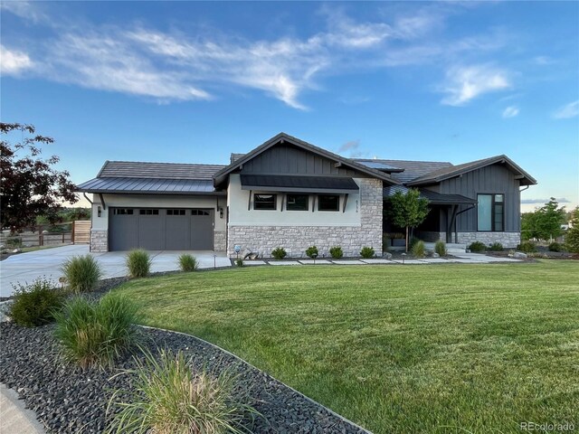 6736 S Flanders Ct, Aurora, CO 80016 - view of front of property with stone siding, a garage, and a front lawn