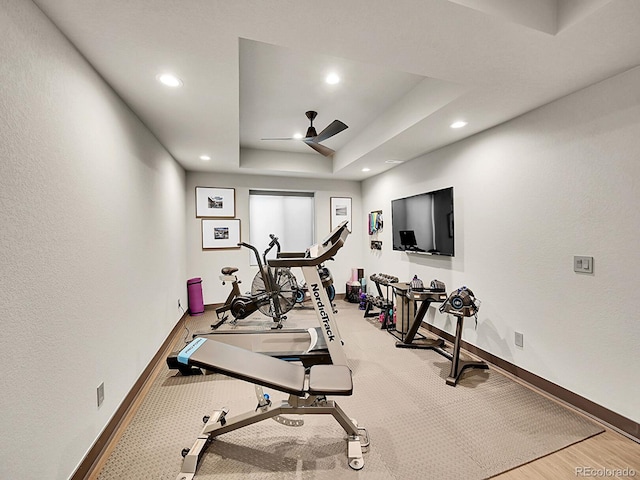 6736 S Flanders Ct, Aurora, CO 80016 - exercise room featuring baseboards, ceiling fan, recessed lighting, a tray ceiling, and wood finished floors