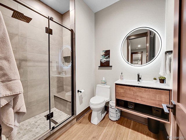 6736 S Flanders Ct, Aurora, CO 80016 - full bath with toilet, wood finished floors, vanity, and a shower stall