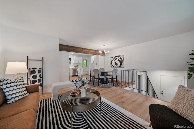 116 Monarch St, Louisville, CO 80027 - living area with a chandelier, wood finished floors, and baseboards