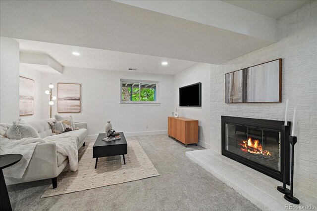 116 Monarch St, Louisville, CO 80027 - carpeted living area with a brick fireplace, baseboards, and recessed lighting