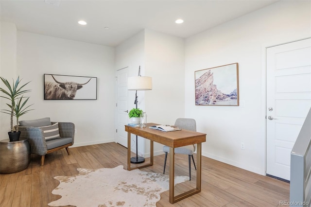 office area featuring recessed lighting, baseboards, and light wood finished floors