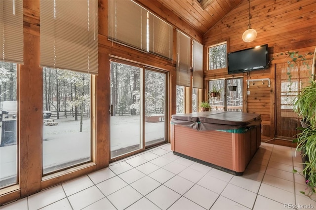 welcome area featuring high vaulted ceiling, wooden walls, and wooden ceiling