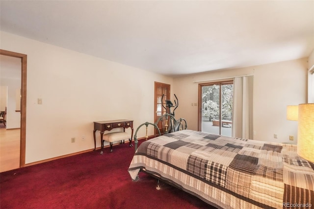 bedroom with carpet floors and baseboards