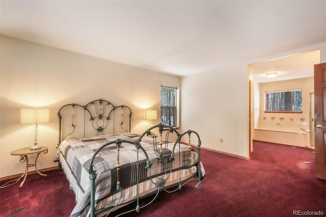 carpeted bedroom featuring baseboards