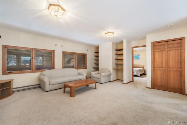 carpeted living room with baseboard heating