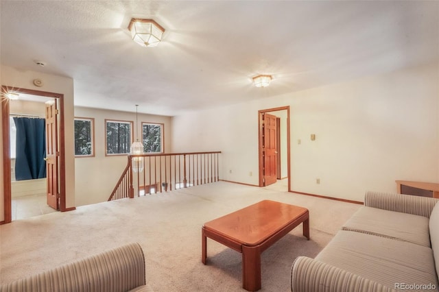 living room with carpet floors and baseboards