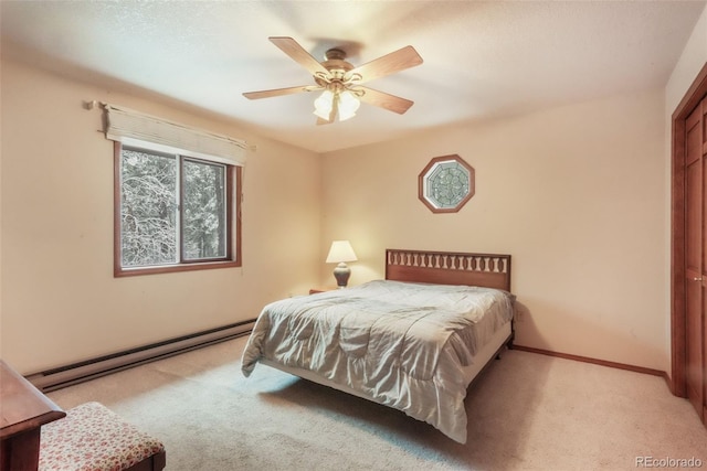 bedroom with a baseboard radiator, carpet, baseboards, and ceiling fan