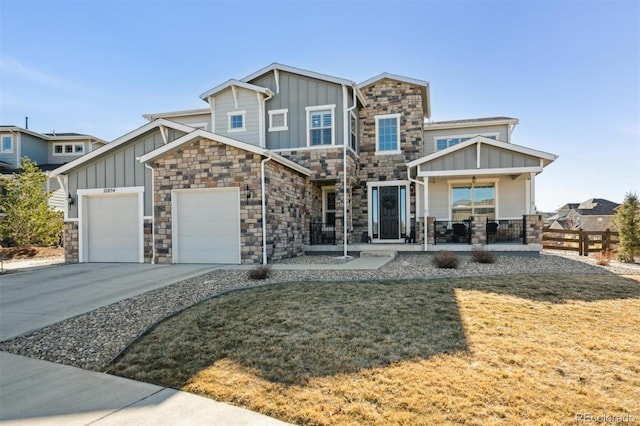 view of front facade featuring an attached garage, driveway, a porch, and board and batten siding