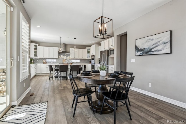 dining space with a chandelier, recessed lighting, visible vents, baseboards, and dark wood-style floors