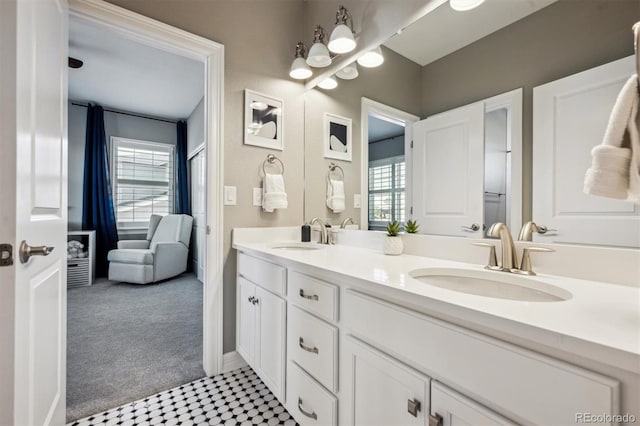 bathroom with double vanity and a sink