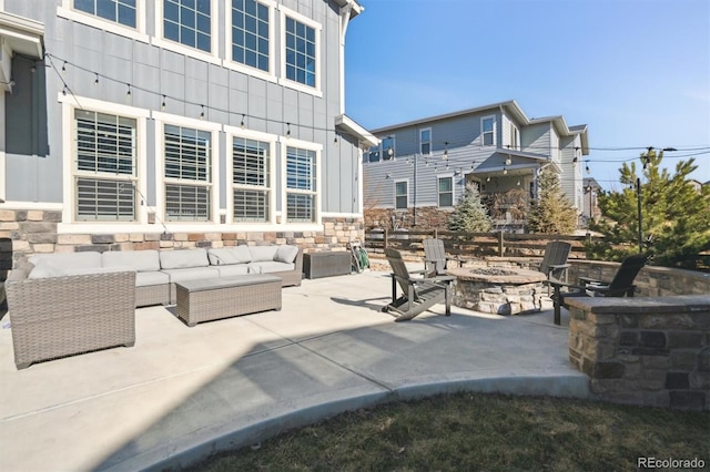 view of patio / terrace featuring an outdoor living space with a fire pit