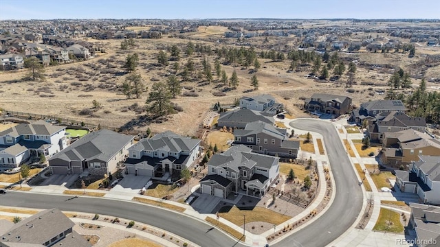 birds eye view of property with a residential view