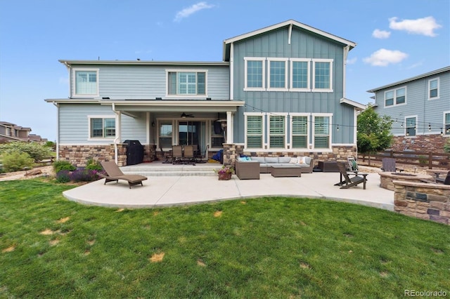 21854 Tyrolite Ave, Parker, CO 80138 - back of property with an outdoor living space with a fire pit, board and batten siding, stone siding, and a yard