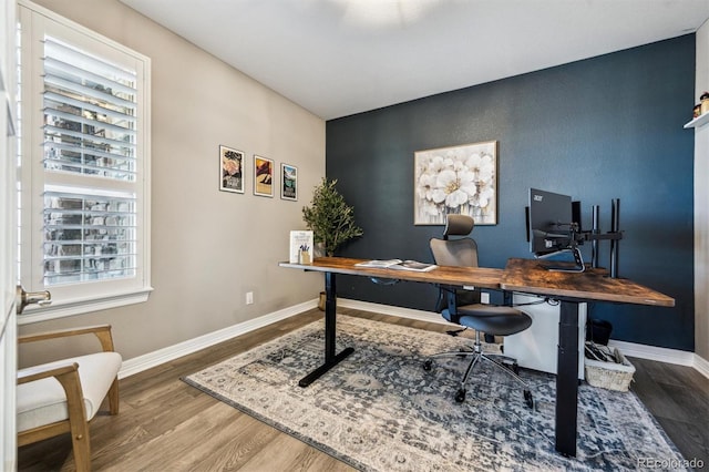 21854 Tyrolite Ave, Parker, CO 80138 - office space with healthy amount of natural light, an accent wall, and baseboards