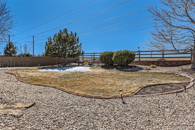 view of yard featuring fence