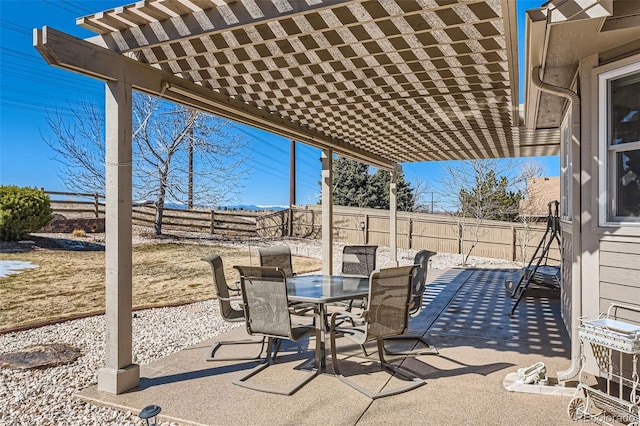 view of patio / terrace with a fenced backyard, outdoor dining area, and a pergola