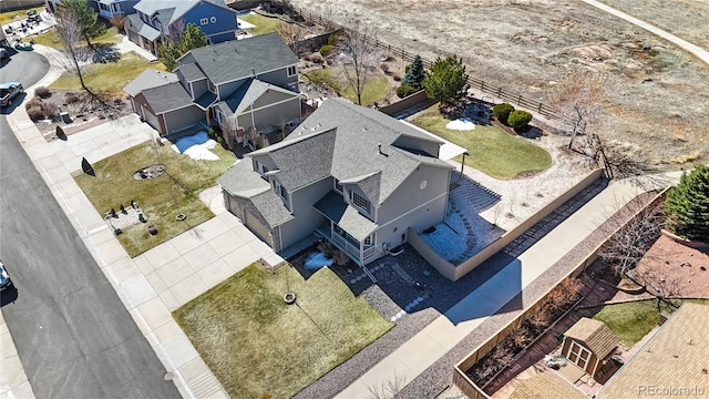 birds eye view of property with a residential view