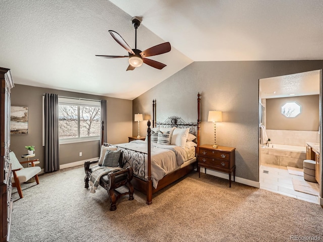 bedroom featuring light carpet, ceiling fan, baseboards, and lofted ceiling