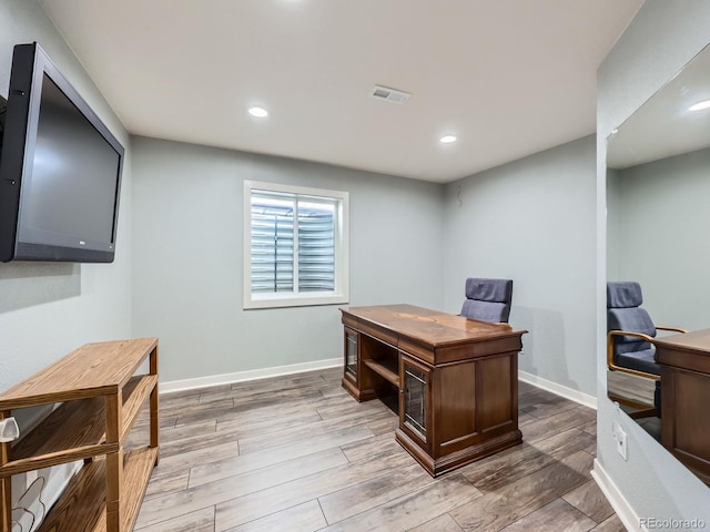 office with light wood finished floors, baseboards, visible vents, and recessed lighting