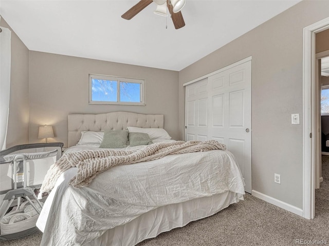 bedroom with ceiling fan, a closet, baseboards, and carpet flooring