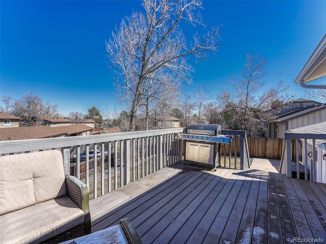 wooden terrace featuring fence