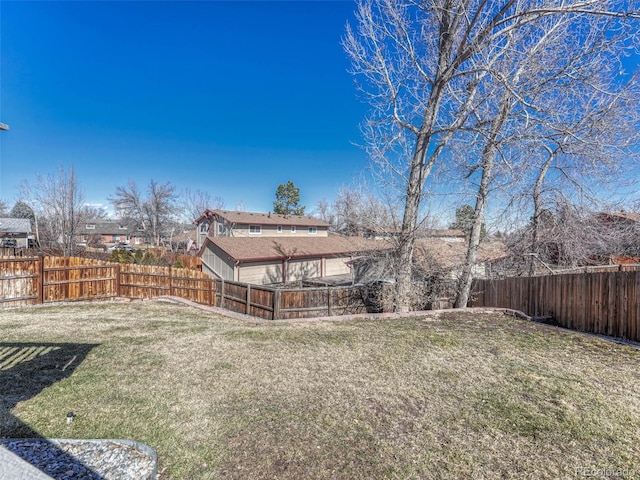 view of yard featuring a fenced backyard