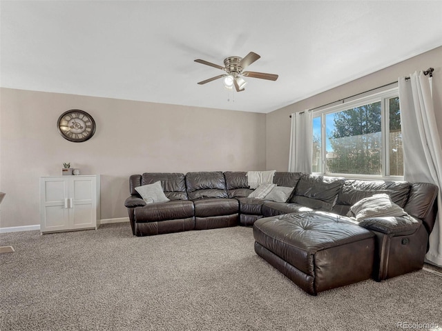 living room with a ceiling fan, baseboards, and carpet flooring