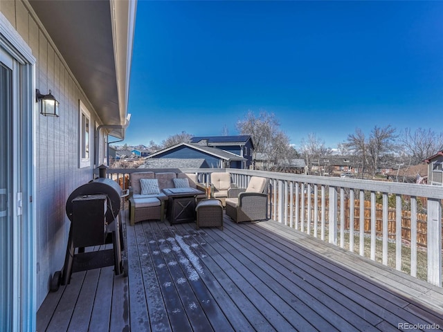 wooden deck featuring a residential view and an outdoor hangout area