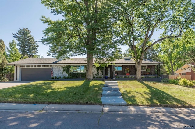 6760 S Depew St, Littleton, CO 80128 - ranch-style home featuring a garage and driveway