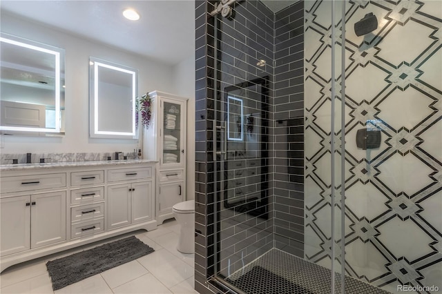 6760 S Depew St, Littleton, CO 80128 - full bath featuring a stall shower, double vanity, and tile patterned floors