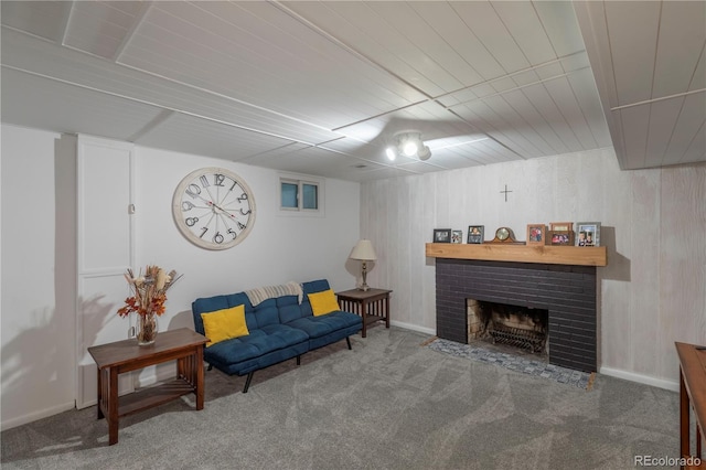 6760 S Depew St, Littleton, CO 80128 - living area featuring carpet, a brick fireplace, and wooden walls
