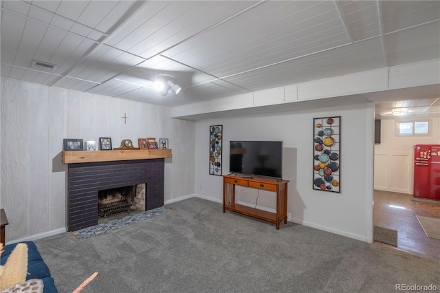 6760 S Depew St, Littleton, CO 80128 - living room featuring carpet flooring and a fireplace